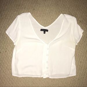 White buttoned slightly cropped shirt
